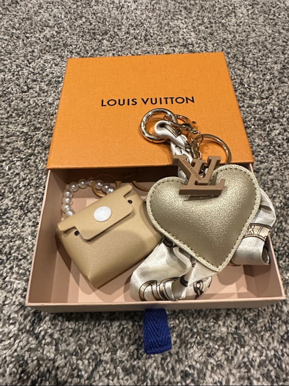 Louis Vuitton Repurposed LV Zipper Pull/ charm on unbranded faux leather heart.